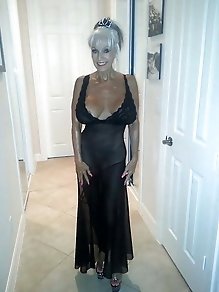 Good-looking mature babe is getting undressed